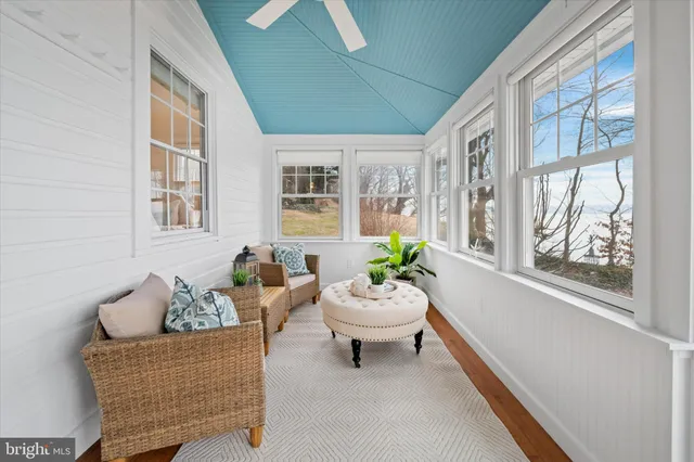 a living room with furniture and windows