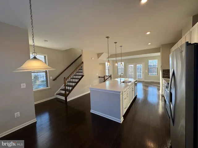 a living room with fireplace furniture and a wooden floor