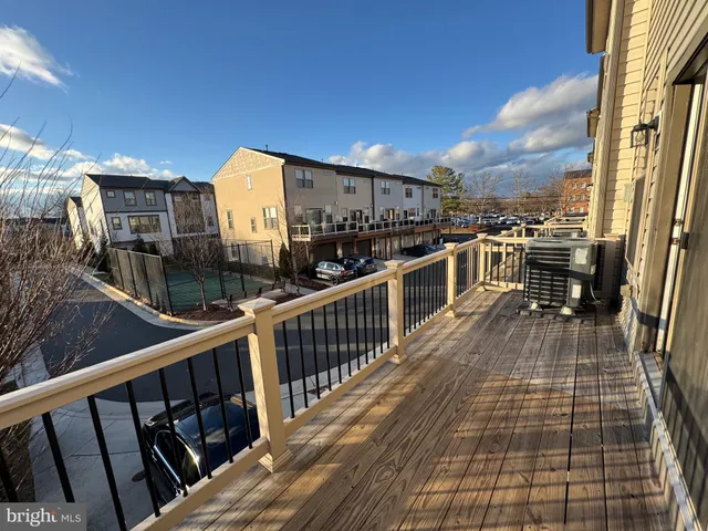 a view of a balcony with wooden floor