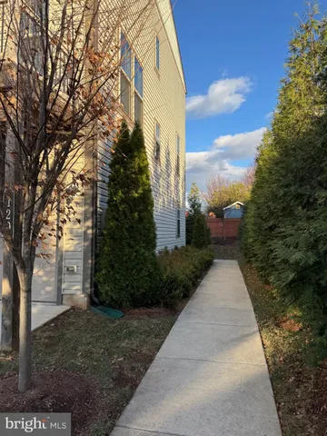 a view of a pathway with a yard