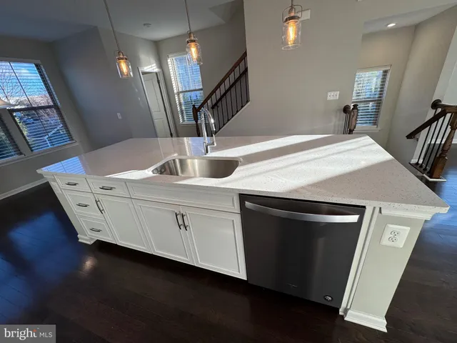 a kitchen with cabinets and sink