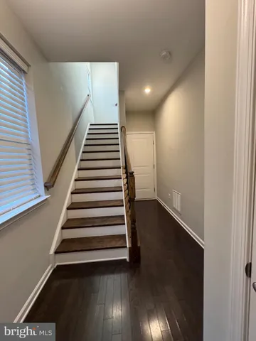 a view of entryway with wooden floor