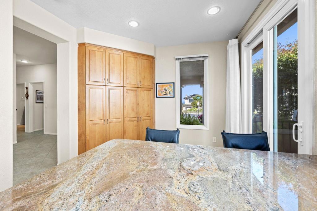 1827 Amalfi Drive Encinitas, CA 92024 - Photo 15 of 31 a bedroom with a bed and a large window