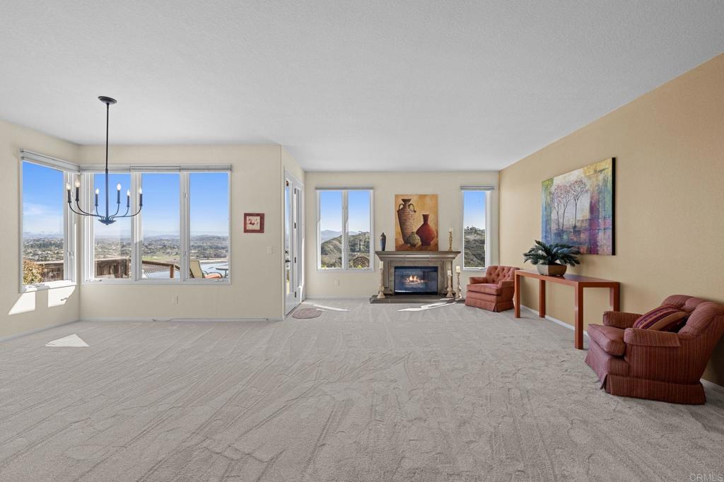 1827 Amalfi Drive Encinitas, CA 92024 - Photo 7 of 31 a room with furniture and a flat screen tv