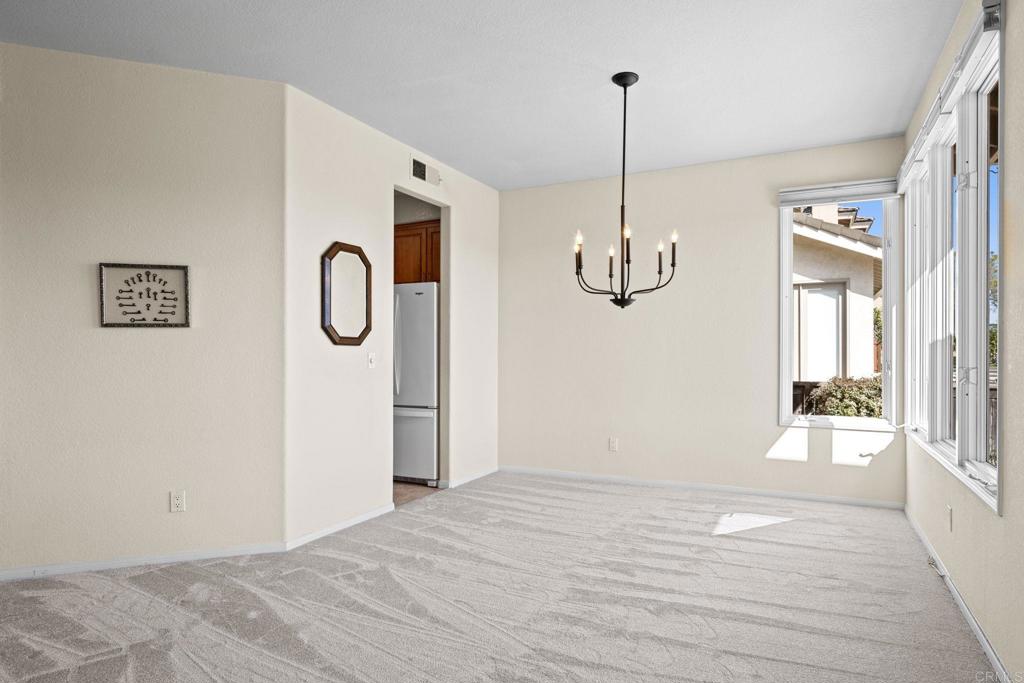 1827 Amalfi Drive Encinitas, CA 92024 - Photo 10 of 31 a view of empty room with wooden floor and ceiling fan