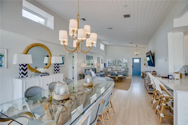 a very nice looking dining room with a table and chairs