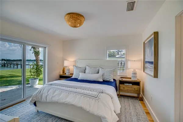 a bedroom with bed and window