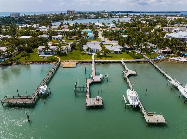 an aerial view of a house with a lake view