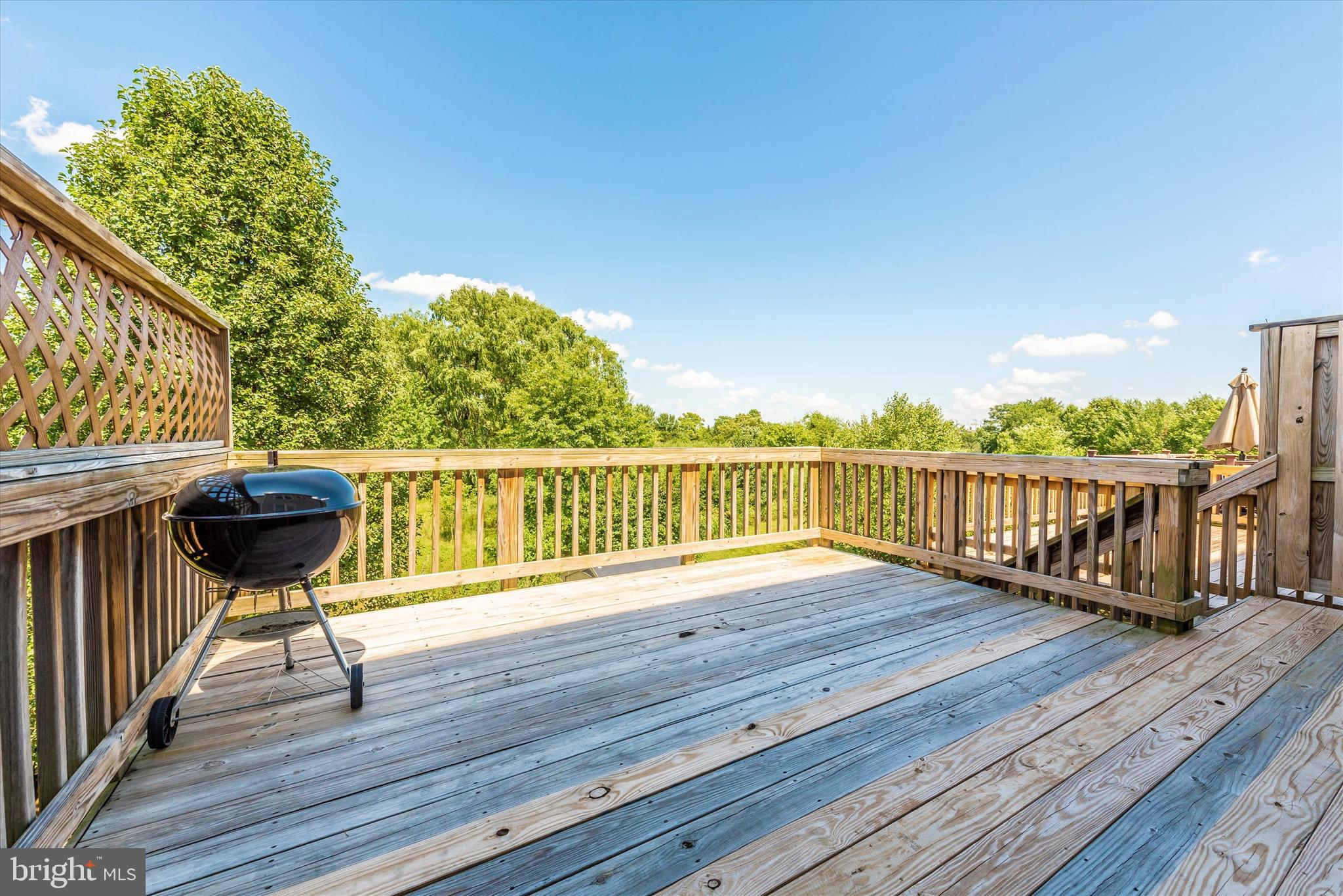 202 Timber View Court Frederick, MD 21702 - Photo 25 of 31 Spacious upper level rear deck with great views.