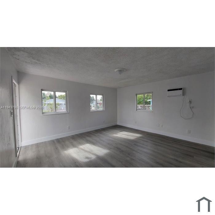 2927 Northwest 60th Street Miami, FL 33142 - Photo 4 of 11 a view of an empty room and window