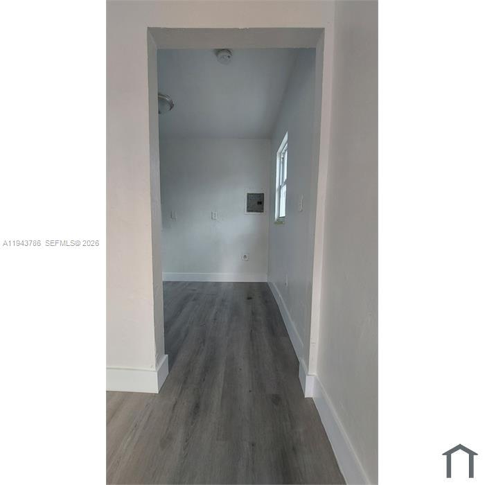 2927 Northwest 60th Street Miami, FL 33142 - Photo 7 of 11 a view of a hallway with wooden floor