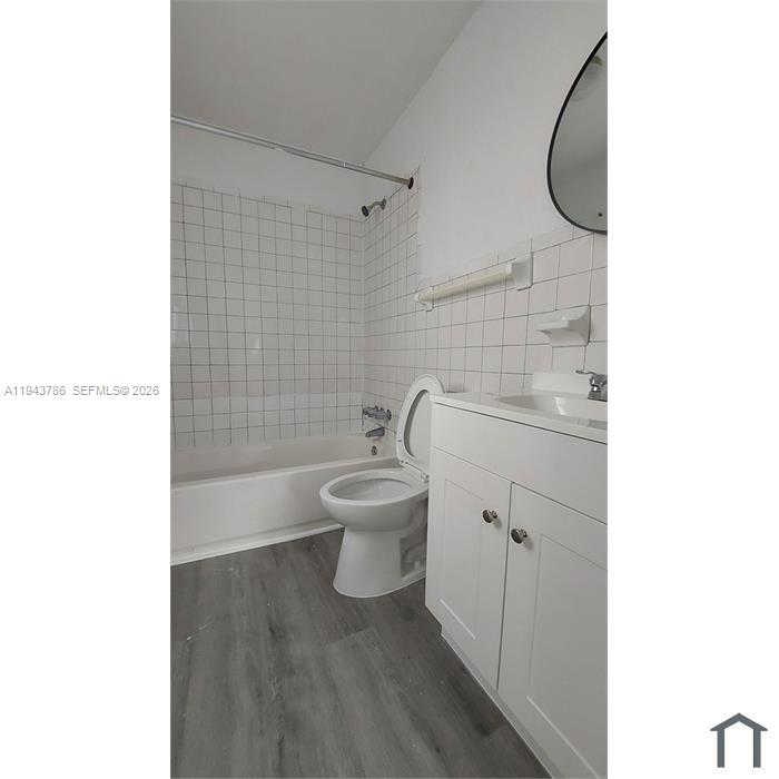 2927 Northwest 60th Street Miami, FL 33142 - Photo 9 of 11 a bathroom with a toilet and a sink