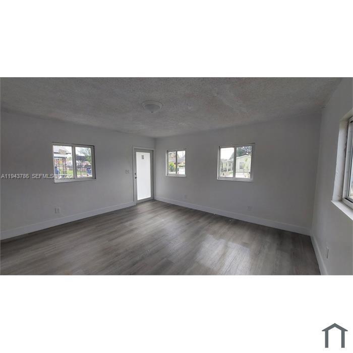 2927 Northwest 60th Street Miami, FL 33142 - Photo 10 of 11 a upper view of a living room and window