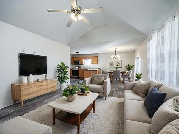 a living room with furniture and a flat screen tv