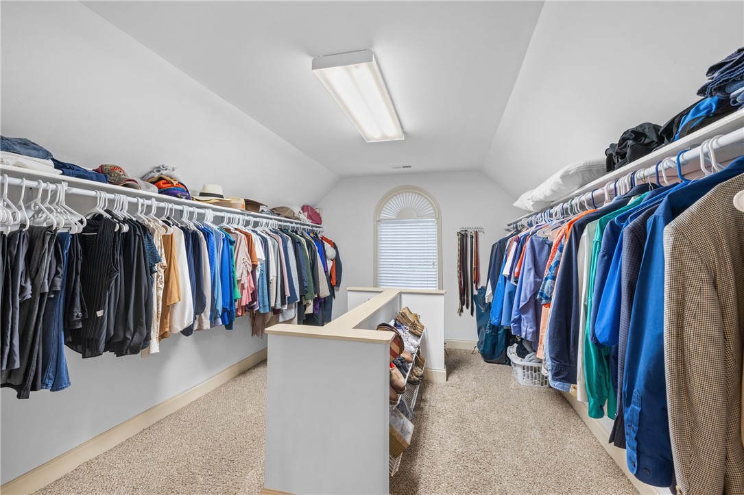106 Red Maple Way Clemson, SC 29631 - Photo 24 of 49 A spacious walk-in closet with built-in organization options and wall-to-wall carpeting.