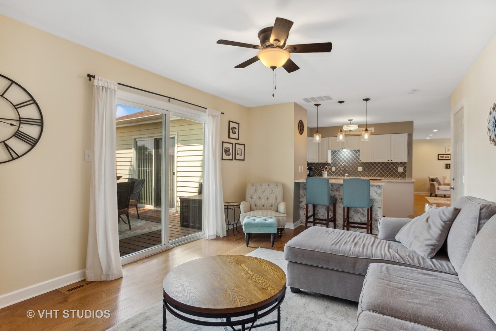 7 Windsor Court Streamwood, IL 60107 - Photo 12 of 22 a living room with furniture and a view of kitchen