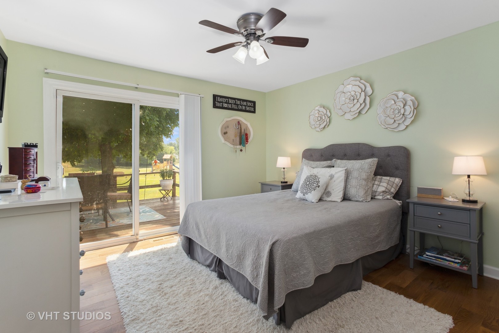 7 Windsor Court Streamwood, IL 60107 - Photo 13 of 22 a bedroom with a bed and a chandelier
