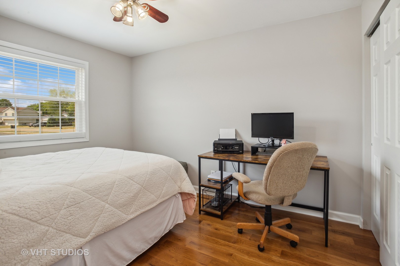 7 Windsor Court Streamwood, IL 60107 - Photo 15 of 22 a view of a workspace with furniture and a window