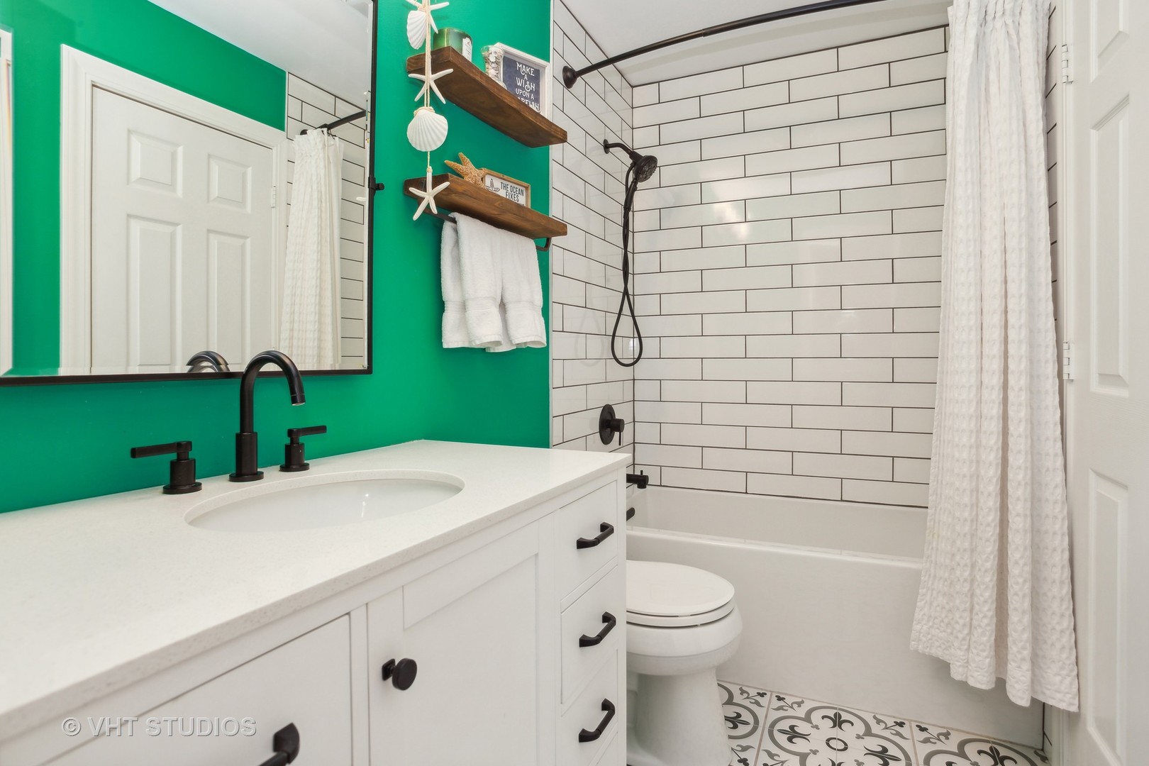 7 Windsor Court Streamwood, IL 60107 - Photo 17 of 22 a bathroom with a sink a toilet and shower