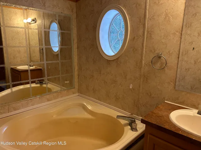 a bathroom with a sink and a shower