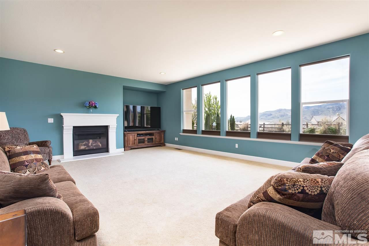 8548 Timaru Trail Reno, NV 89523 - Photo 13 of 25 a living room with furniture and a fireplace