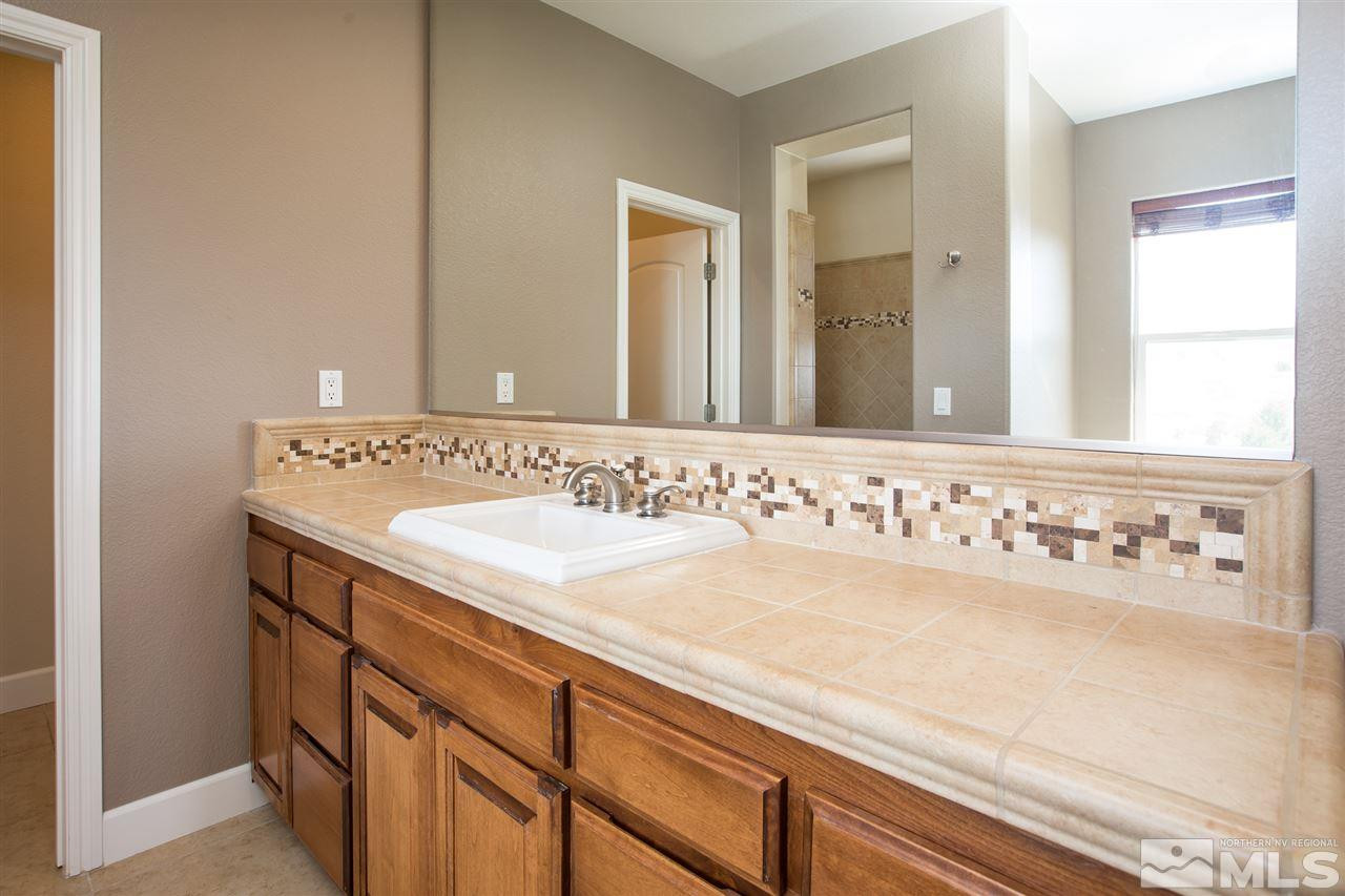 8548 Timaru Trail Reno, NV 89523 - Photo 18 of 25 a bathroom with a sink and a mirror
