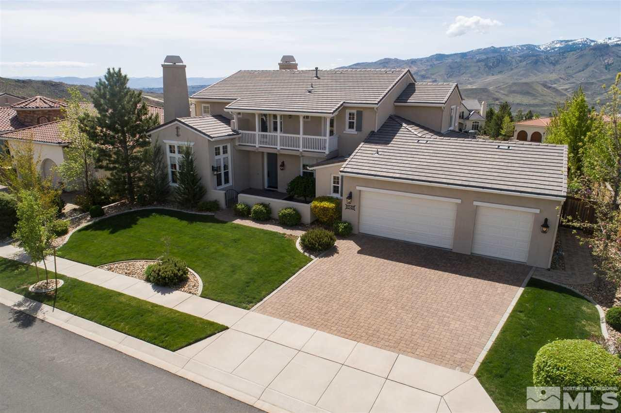 8548 Timaru Trail Reno, NV 89523 - Photo 2 of 25 a aerial view of a house with a yard and garage