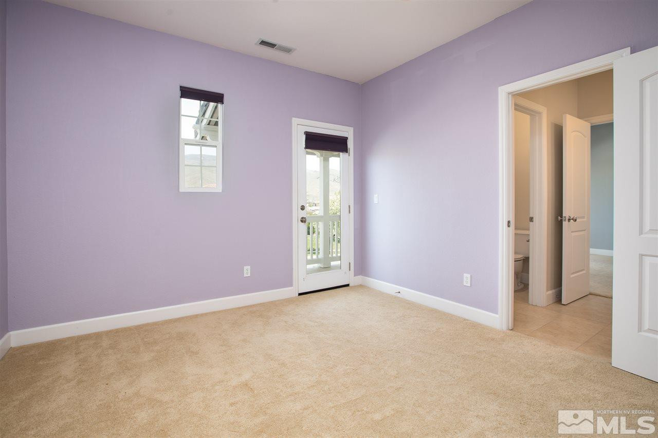 8548 Timaru Trail Reno, NV 89523 - Photo 21 of 25 an empty room with windows and closet