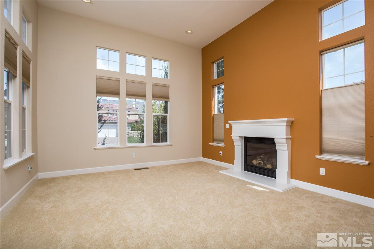 8548 Timaru Trail Reno, NV 89523 - Photo 6 of 25 a view of empty room with a fireplace