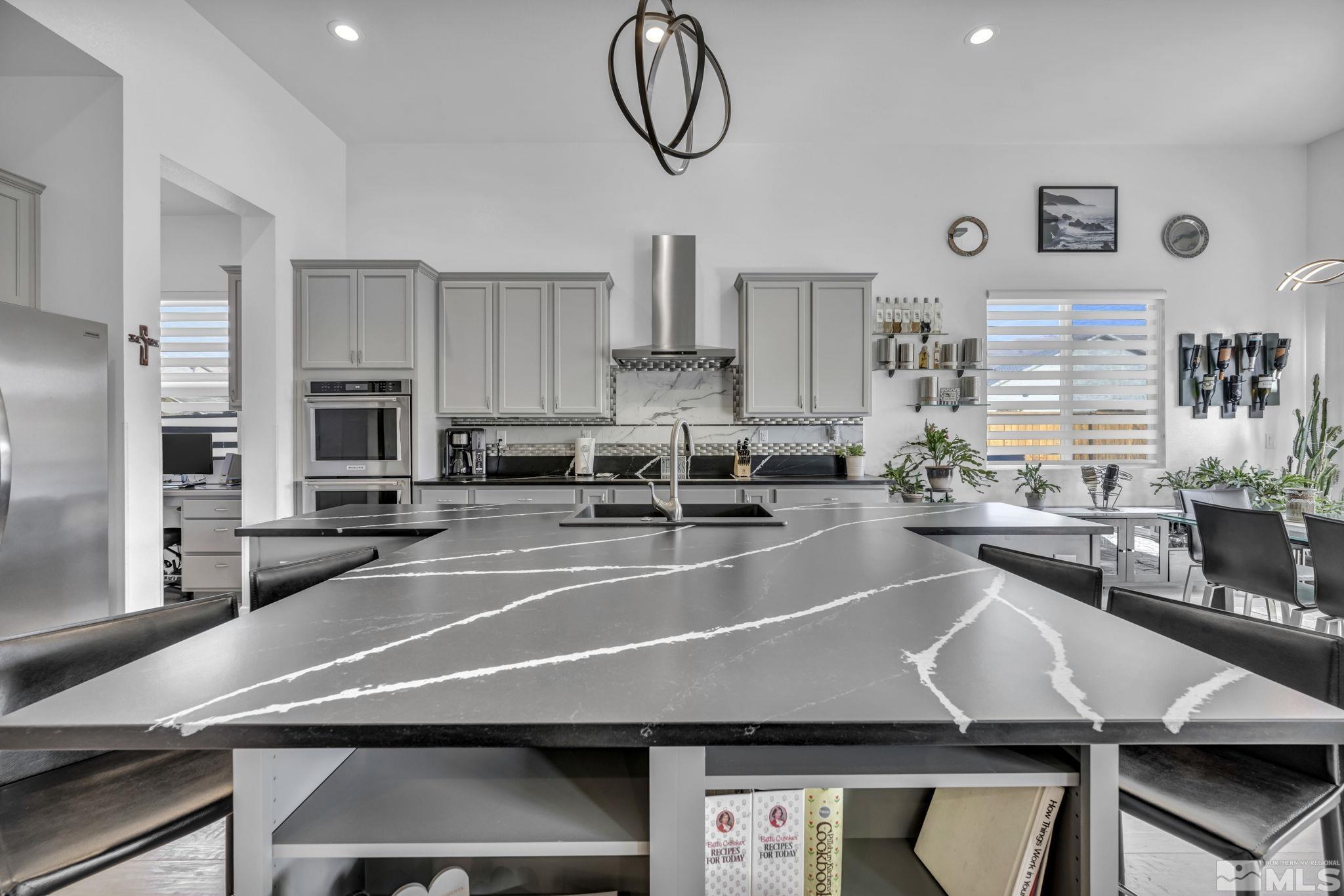 9500 Hawkshead Road Reno, NV 89521 - Photo 12 of 40 a kitchen with table and chairs