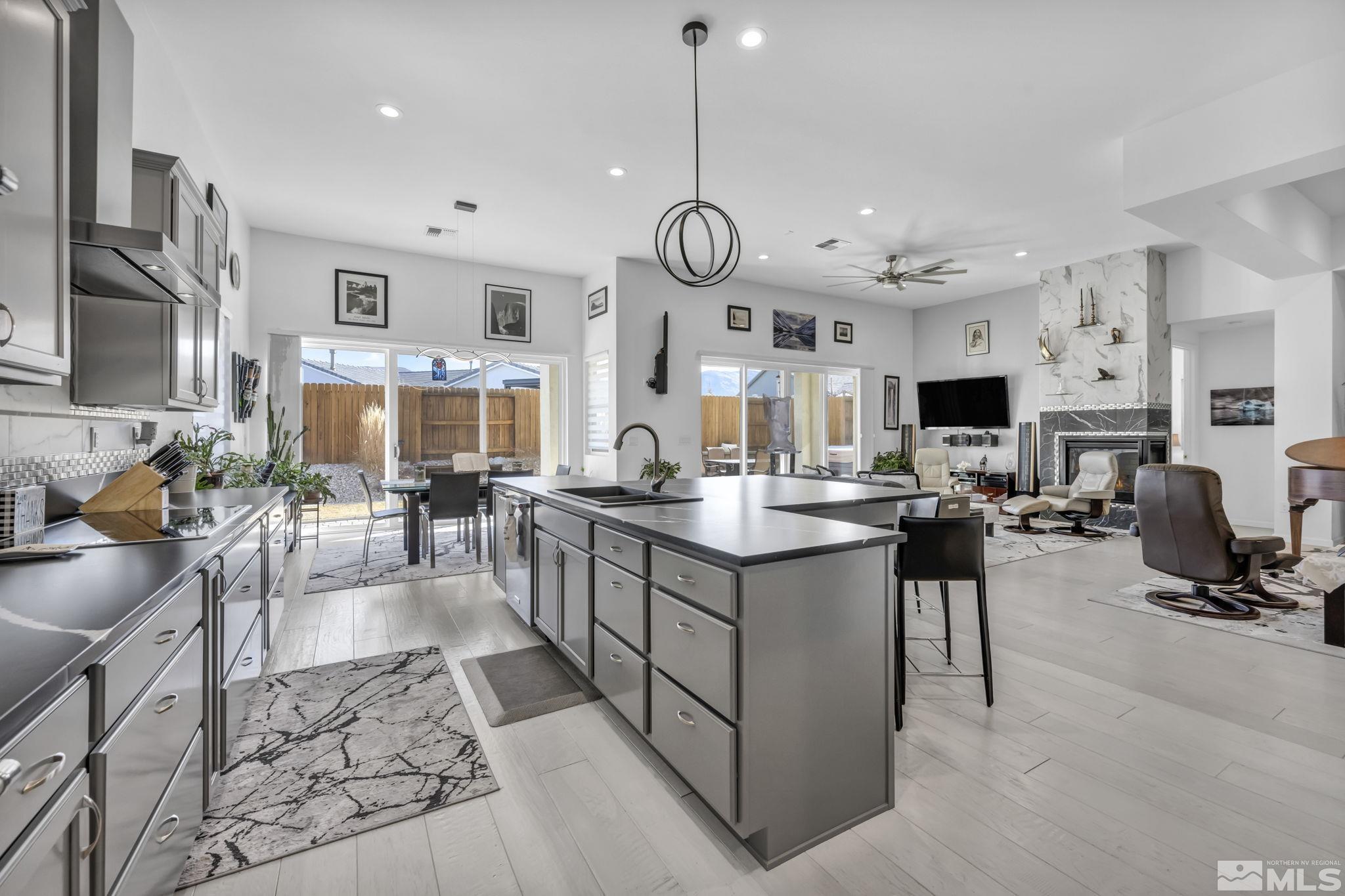 9500 Hawkshead Road Reno, NV 89521 - Photo 14 of 40 a large kitchen with cabinets and a stove