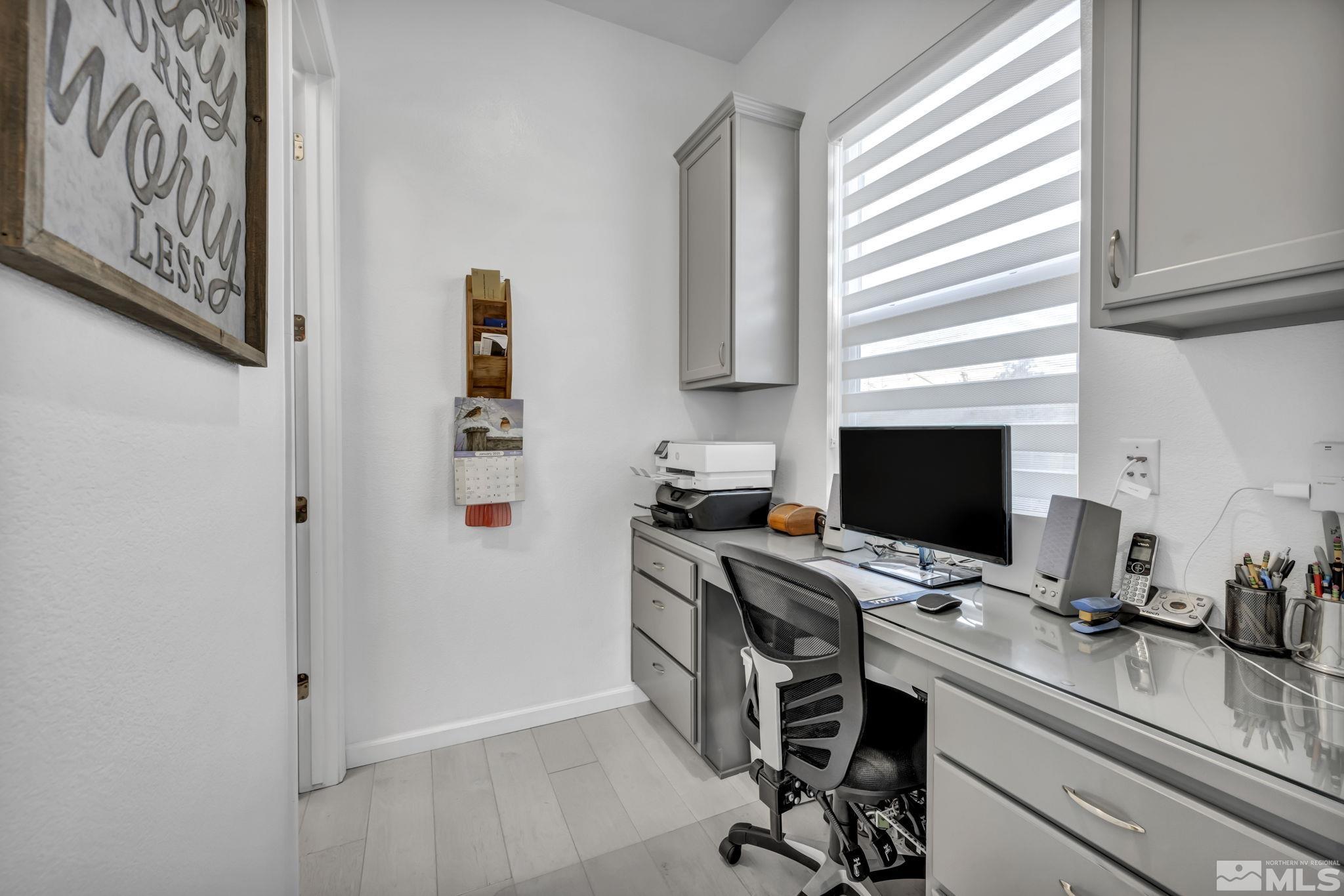 9500 Hawkshead Road Reno, NV 89521 - Photo 17 of 40 a view of a workspace with furniture and a window