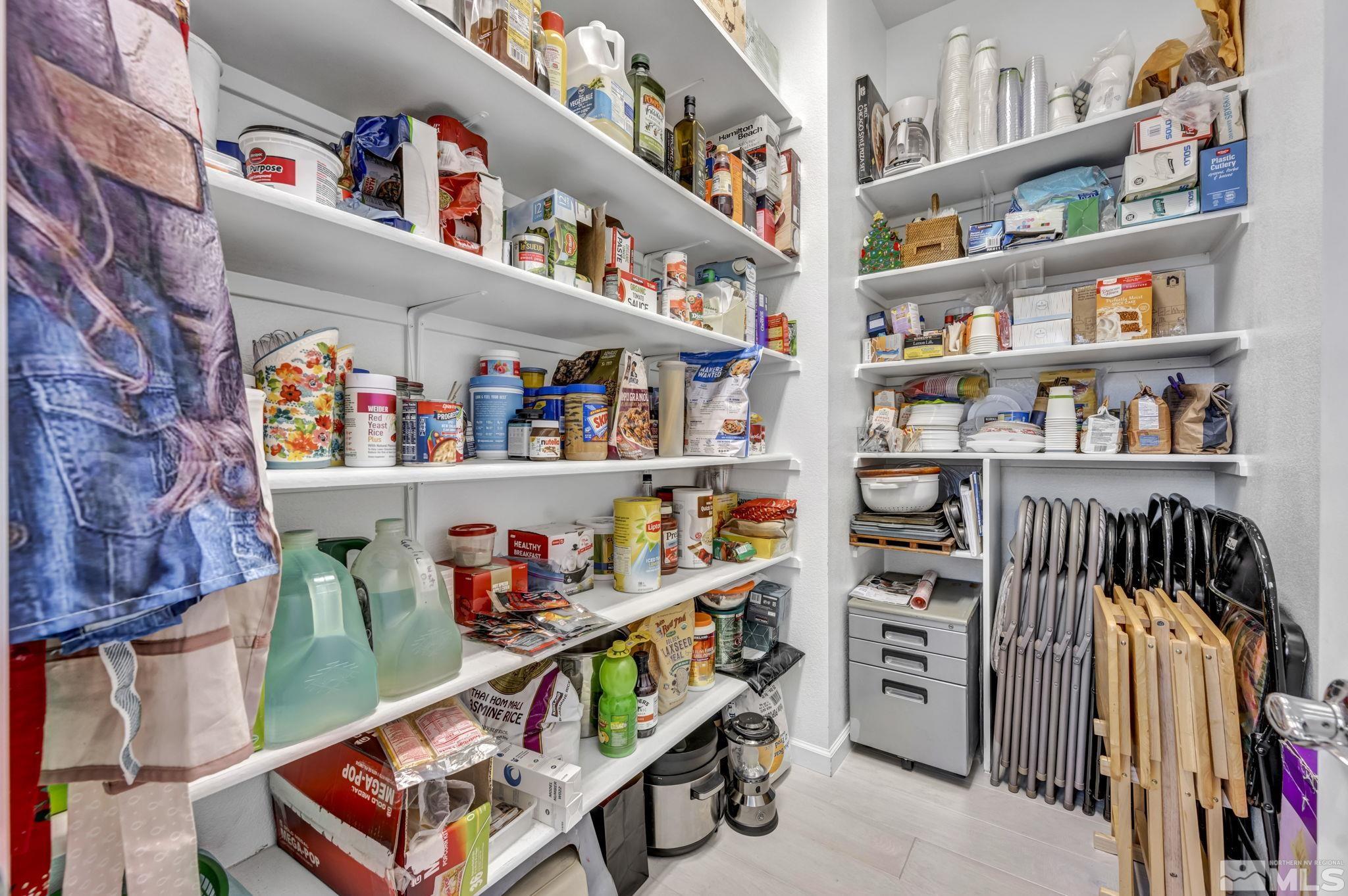 9500 Hawkshead Road Reno, NV 89521 - Photo 18 of 40 a room with furniture and a book shelf