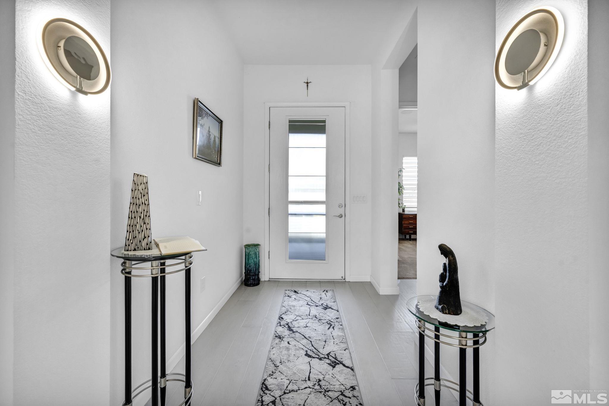 9500 Hawkshead Road Reno, NV 89521 - Photo 21 of 40 a view of a livingroom with furniture and front door