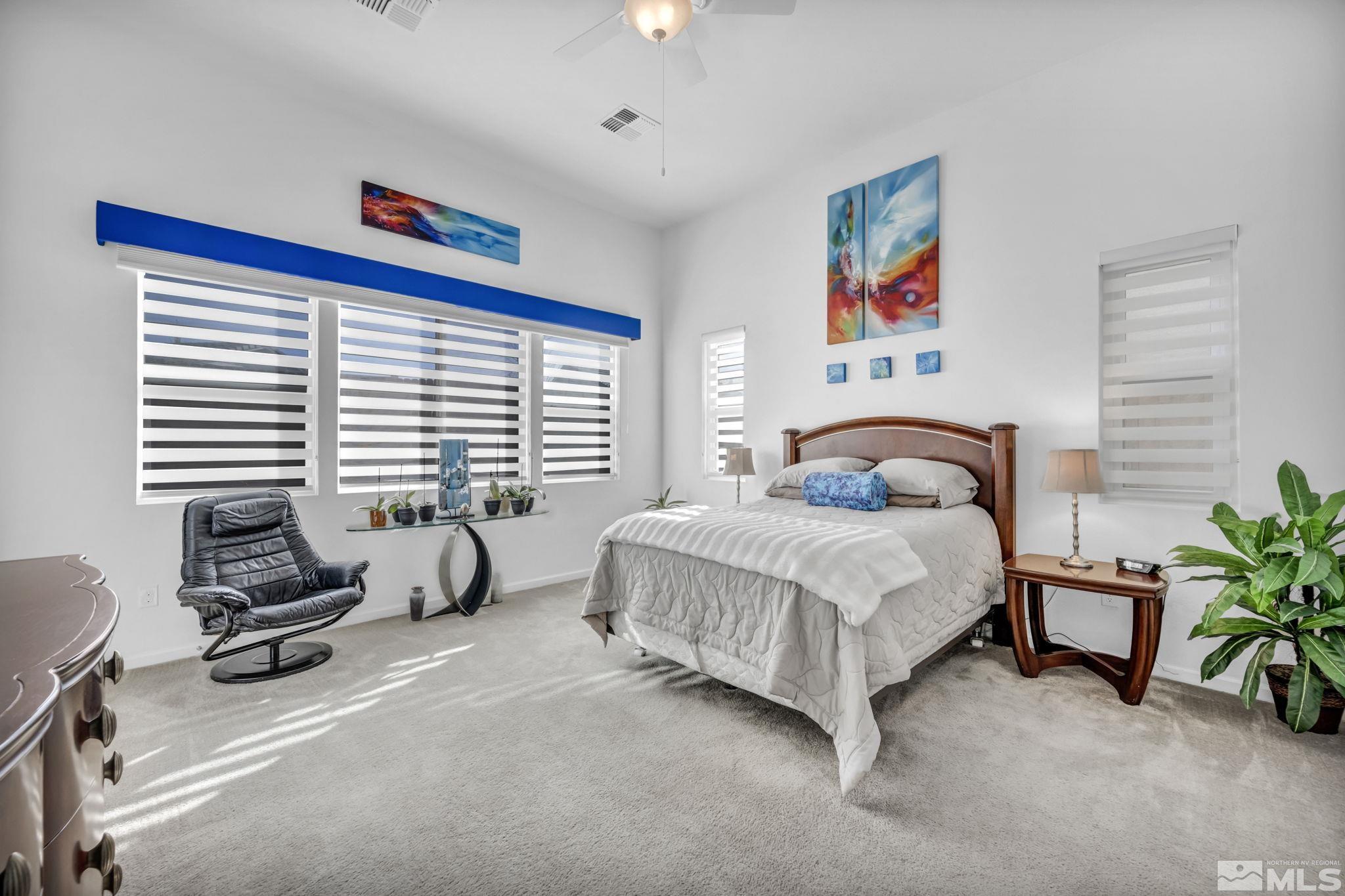 9500 Hawkshead Road Reno, NV 89521 - Photo 22 of 40 a bedroom with a bed and a couch