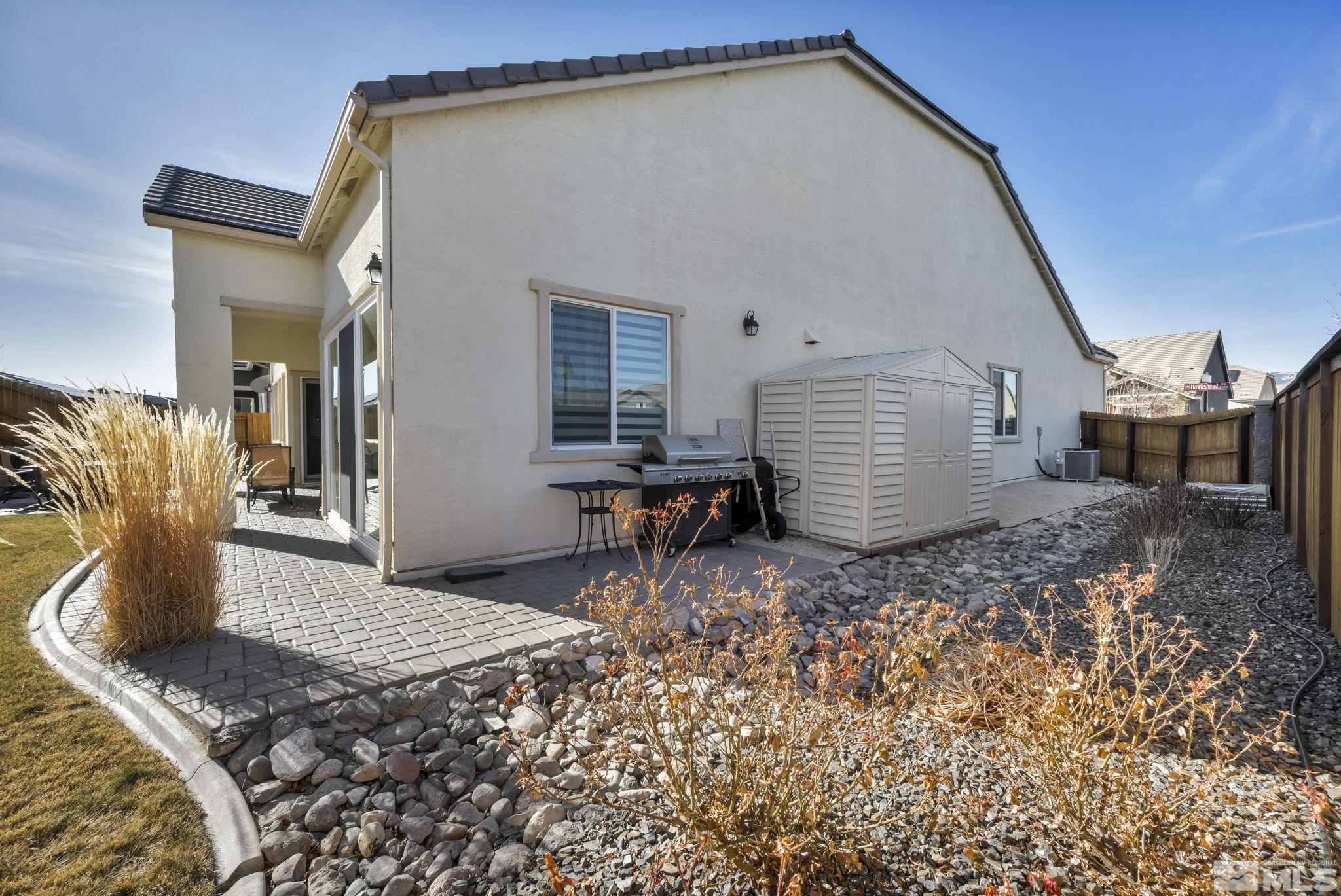 9500 Hawkshead Road Reno, NV 89521 - Photo 34 of 40 a backyard of a house with seating space