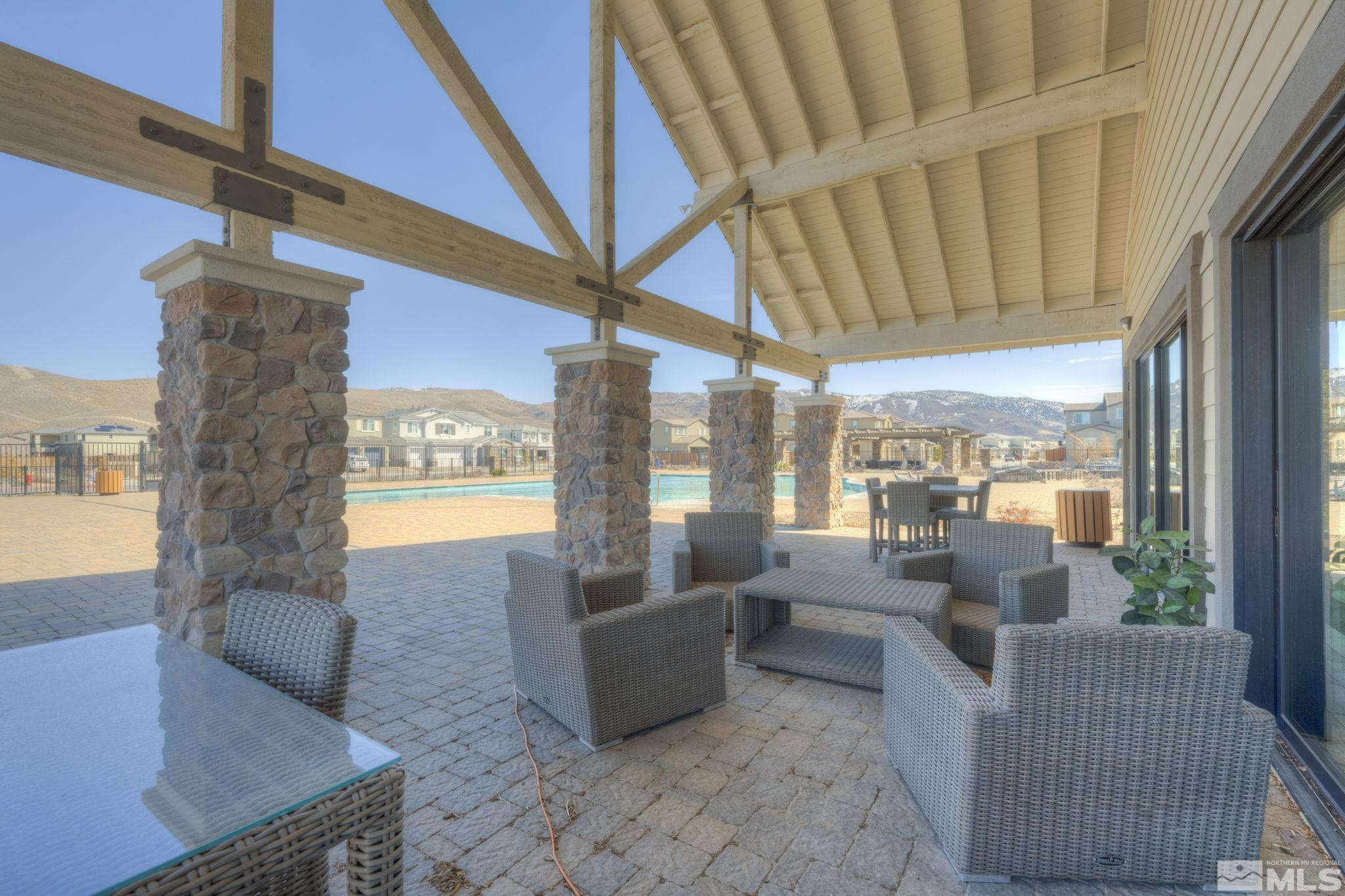 9500 Hawkshead Road Reno, NV 89521 - Photo 37 of 40 a living room with furniture and a floor to ceiling window