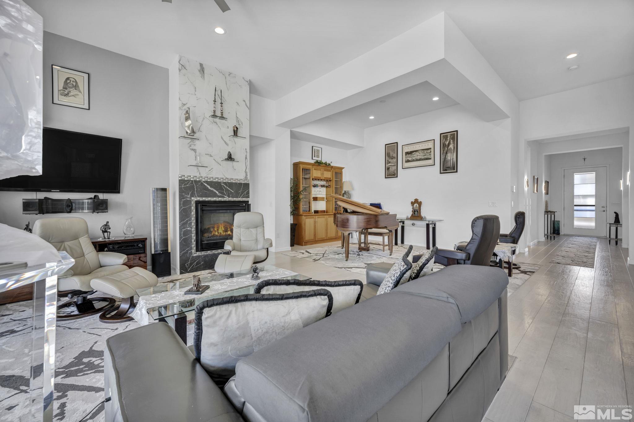 9500 Hawkshead Road Reno, NV 89521 - Photo 4 of 40 a living room with furniture and a flat screen tv