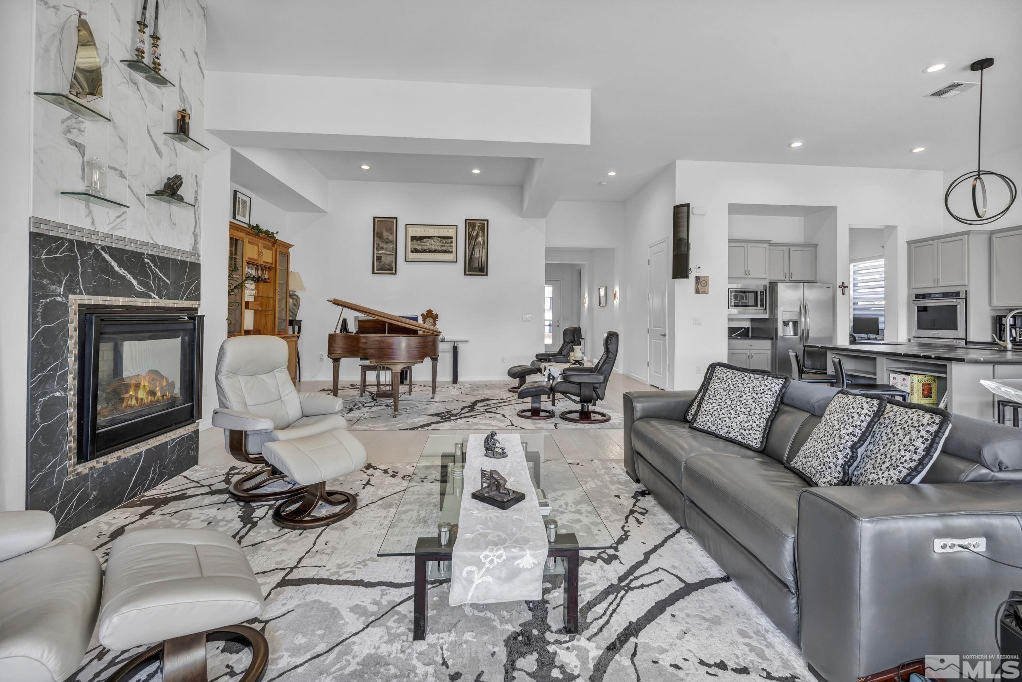 9500 Hawkshead Road Reno, NV 89521 - Photo 5 of 40 a living room with furniture wooden floor and a fireplace