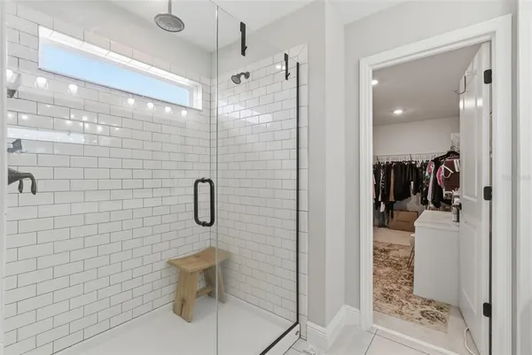 a en suite bathroom with a double vanity sink and a mirror