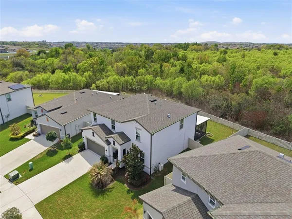 a aerial view of a house with garden space and street view