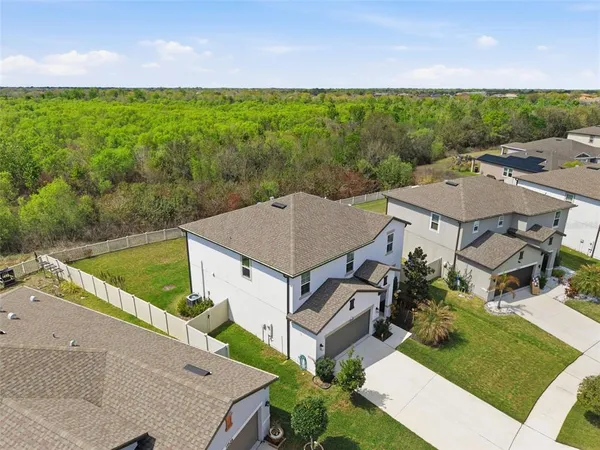 an aerial view of a house with a garden