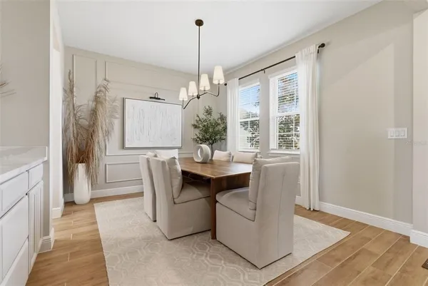 a kitchen with stainless steel appliances granite countertop a sink a stove and cabinets