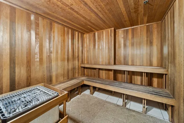 a room with kitchen island stainless steel appliances lots of counter top space
