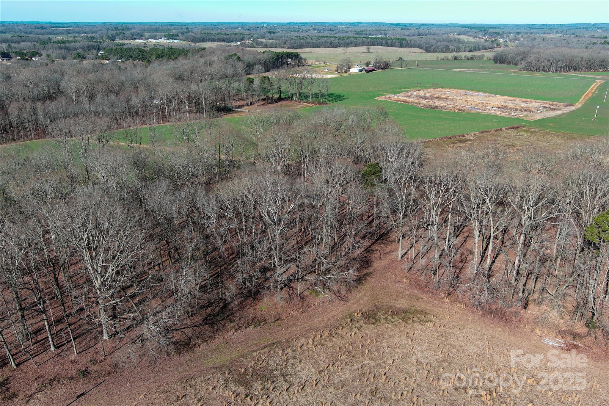 5823 Stack Road Monroe, NC 28112 - Photo 3 of 16 a view of a field with plants and trees