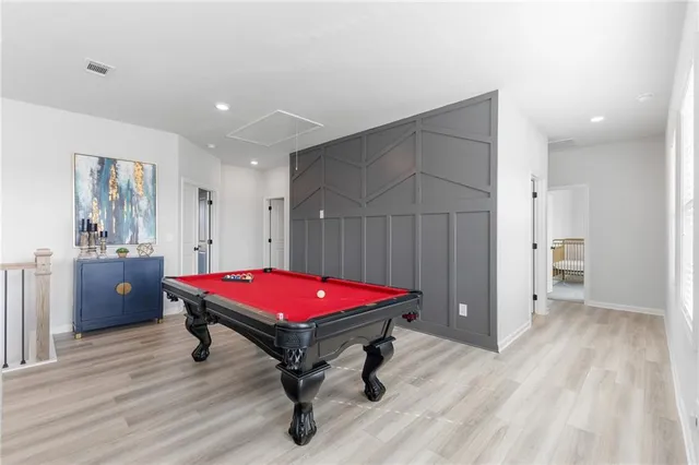 a room with furniture and wooden floor