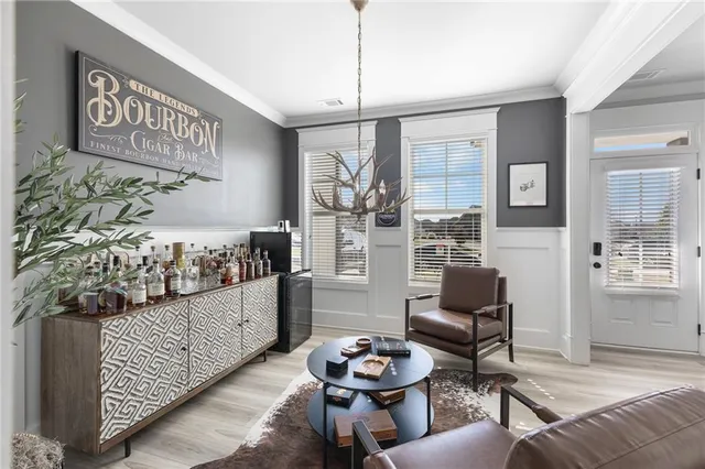 a living room with furniture and a rug