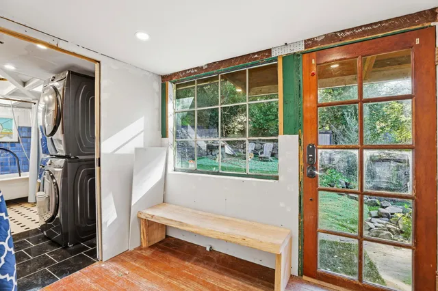a view of empty room with wooden floor