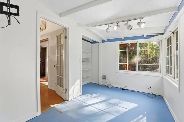 a view of empty room with windows