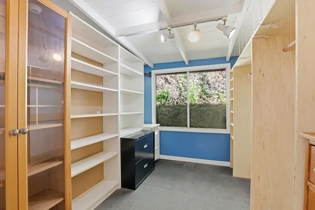 a view of a patio with table and chairs